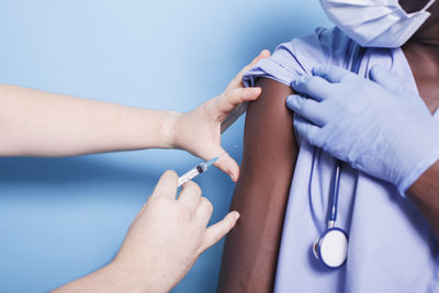 Cropped hand of doctor examining patient