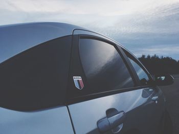 Reflection of car on side-view mirror