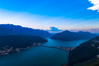 High angle view of mountains against blue sky