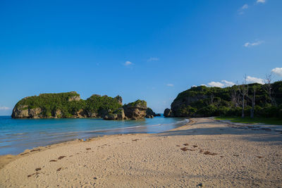 Scenic view of sea against clear blue sky