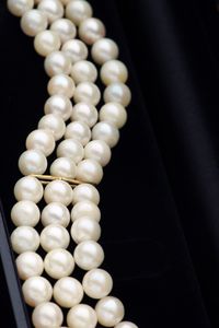 Close-up of pearl necklaces in box