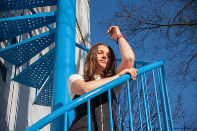 Low angle view of woman on slide at playground