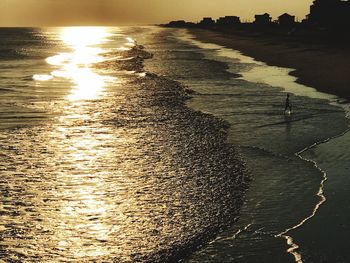 Scenic view of sea against sky at sunset