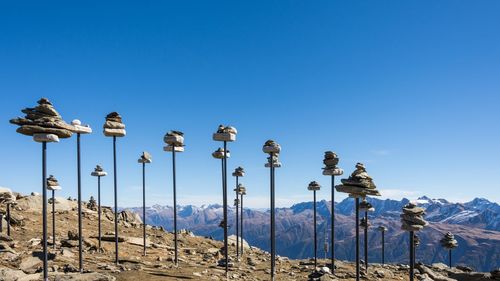 Panoramic view of mountains against clear blue sky