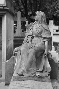 Statue against building