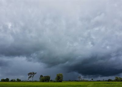 Storm clouds over field