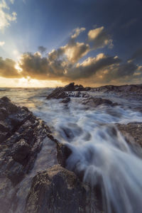 Scenic view of sea against sky during sunset