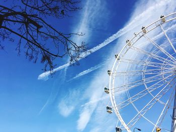 Low angle view of ferris wheel against sky