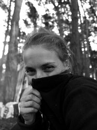 Portrait of young woman in forest