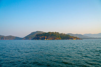Scenic view of sea against clear blue sky