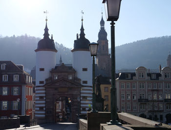 Buildings in city against clear sky