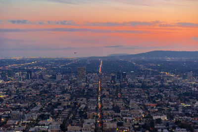 High angle view of city buildings during sunset