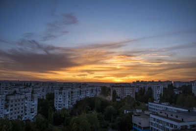 High angle view of buildings against sky during sunset