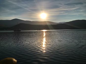 Scenic view of lake at sunset