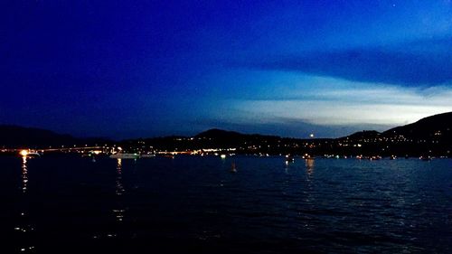 Scenic view of calm sea against sky at night