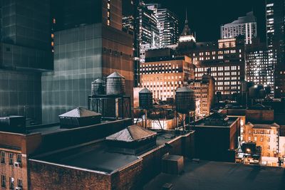 Low angle view of illuminated buildings at night