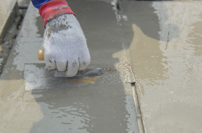 Man working on wet puddle