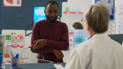 Side view of female doctor working at clinic