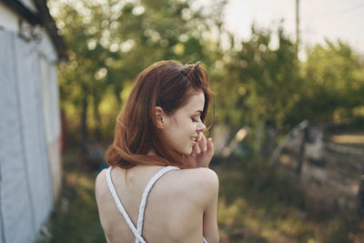 Portrait of young woman looking at camera