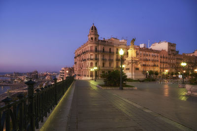 Illuminated buildings in city at night