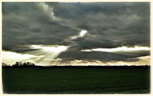Scenic view of landscape against cloudy sky