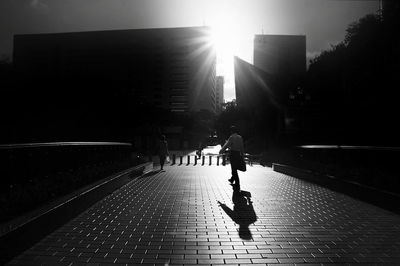 Full length of woman walking on city street