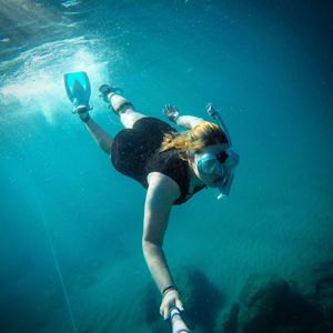 Full length of woman swimming in sea