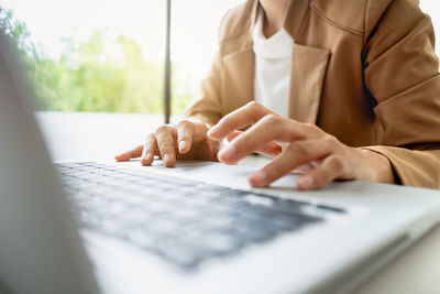 Close-up of woman using mobile phone