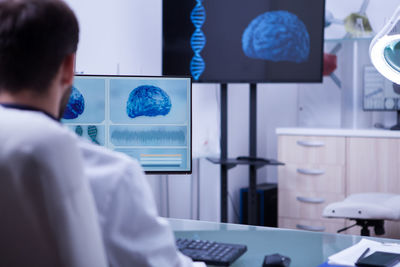 Side view of boy working in office