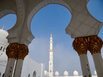 Low angle view of mosque against clear sky