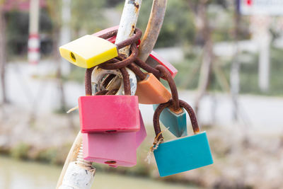 Close-up of padlocks hanging on metal