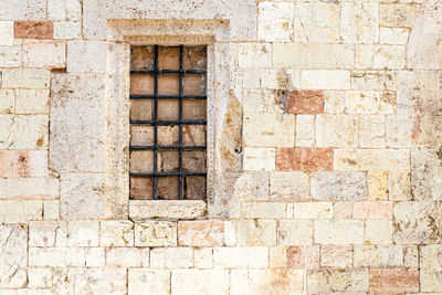 Low angle view of window on old building