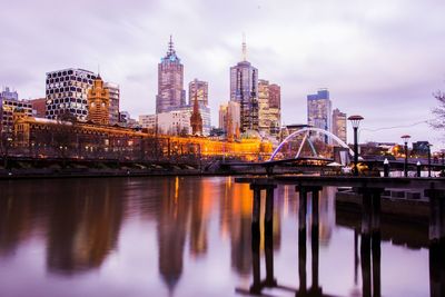 Illuminated city at waterfront