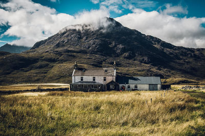 House on field against sky