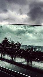 Road seen through wet window