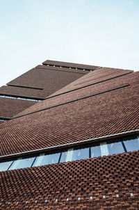 Low angle view of buildings against clear sky