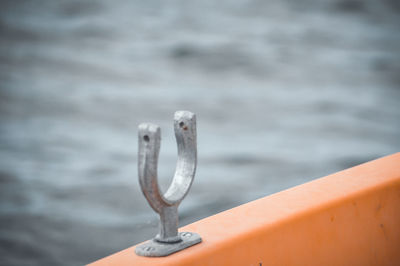 Close-up of rope tied to railing