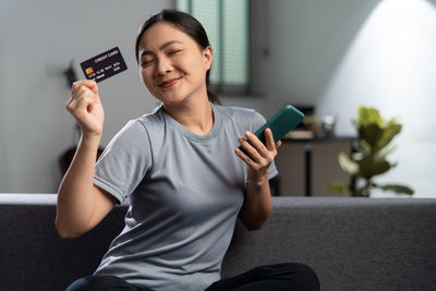Young woman using mobile phone