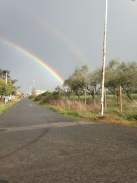 Scenic view of rainbow over street in city