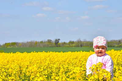 Full length of girl standing on field
