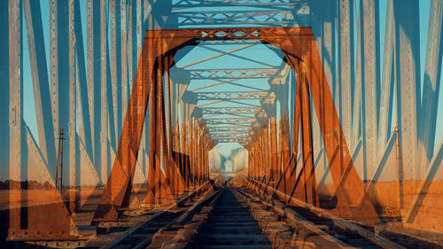 Symmetric composition with old rusty bridge