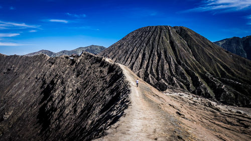 Panoramic view of arid landscape against sky