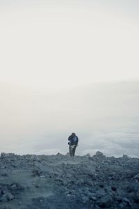 Rear view of man standing on top mountain mahameru