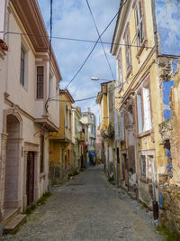 Narrow alley amidst old buildings in town