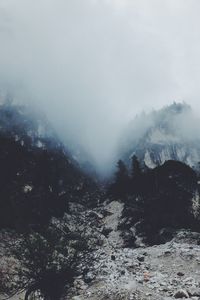 Scenic view of mountains during winter against sky
