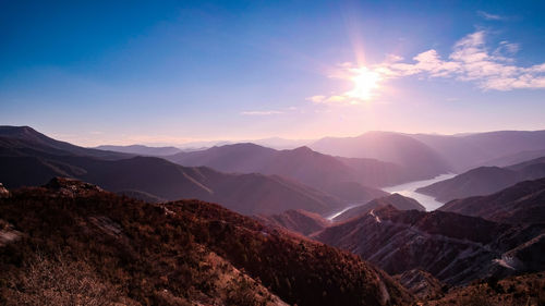 Scenic view of mountains against sky during sunset