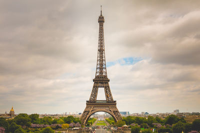 Tower against cloudy sky