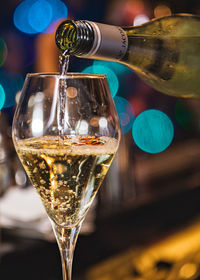 Champagne poured in a glass from a bottle