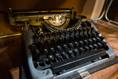 Close-up of old typewriter on table