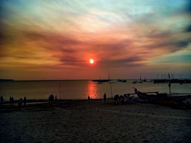 sea, sunset, water, beach, horizon over water, sky, scenics, tranquil scene, tranquility, beauty in nature, shore, idyllic, orange color, cloud - sky, nature, silhouette, sand, sun, incidental people, dramatic sky